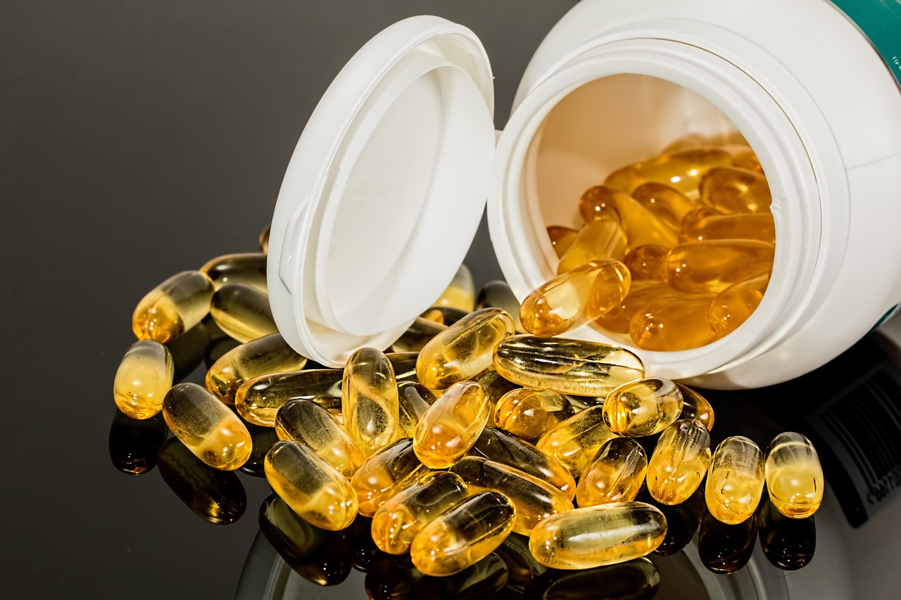 Close-up of translucent softgel supplement capsules, the kind marketed as AMPK activators or longevity aids