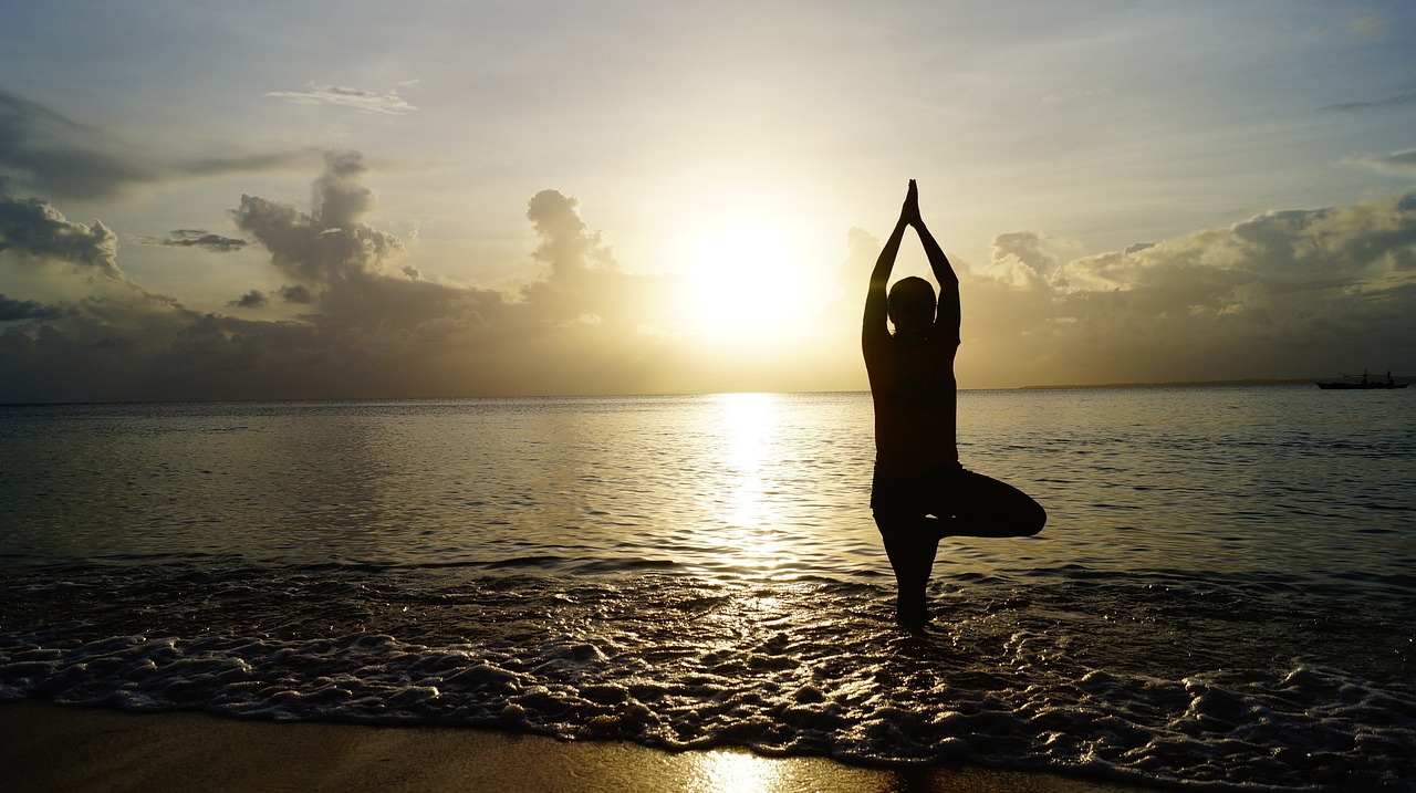 Beach, yoga, sunset — illustrating Autoregulation: Adjusting Training Load to How You Actually Feel