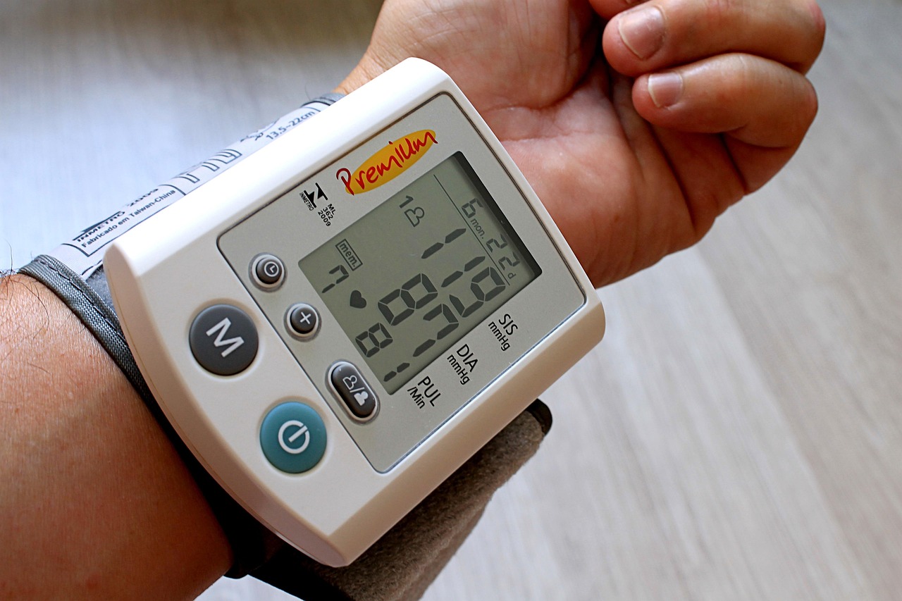 Close-up of a blood pressure gauge and cuff used for measuring and tracking readings at home
