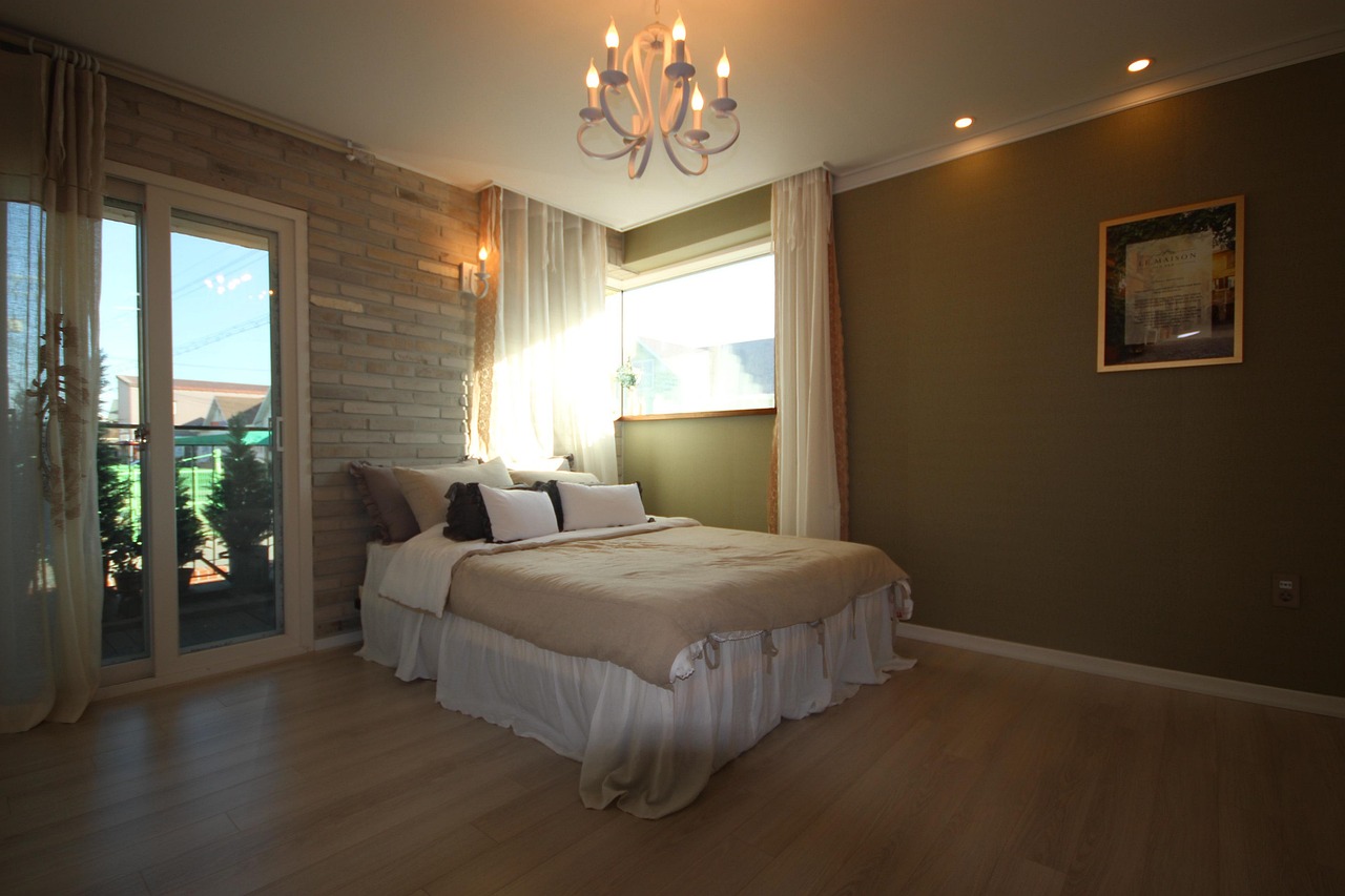 A softly lit, comfortable bedroom made up for restful sleep, representing the deep sleep stages caffeine can erode