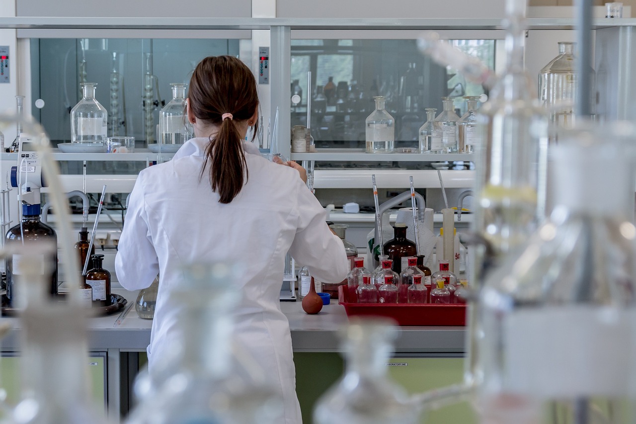 Clinical researcher in a laboratory reviewing test results, evoking the randomized controlled trials used to evaluate myostatin-blocking drugs