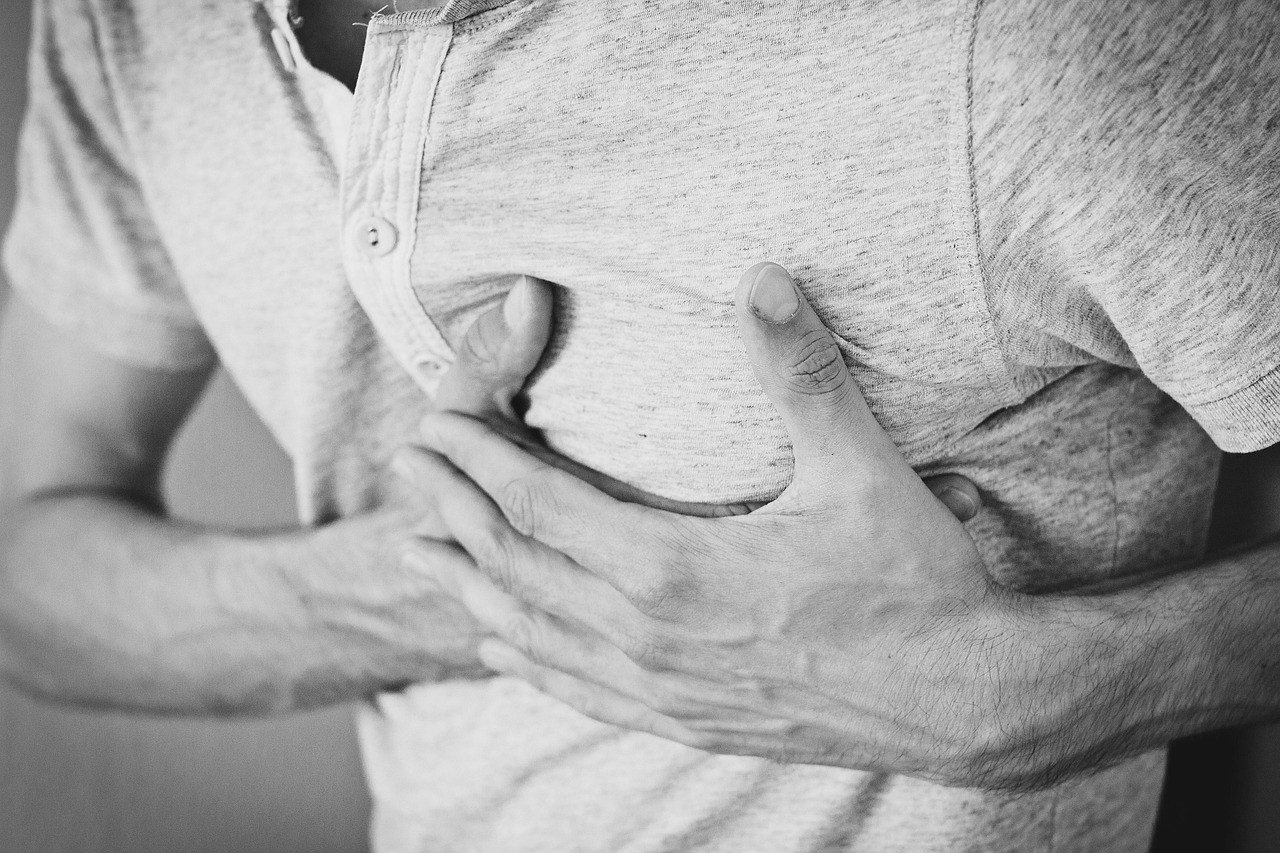 Man, heartache, chest pain — illustrating GLP-1s and Appetite Hormones: Leptin and Ghrelin