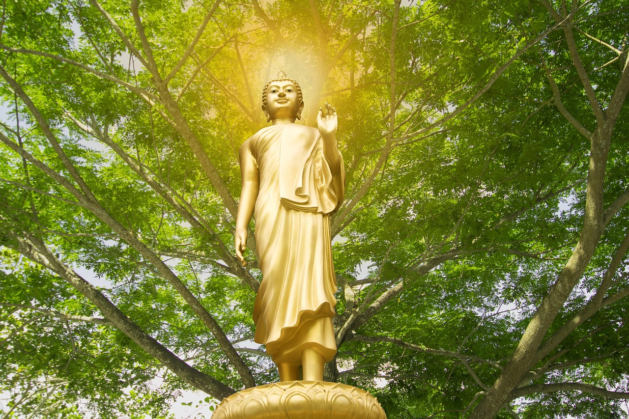 Buddha, isolated, gold — illustrating Glucose Variability and Healthy Aging