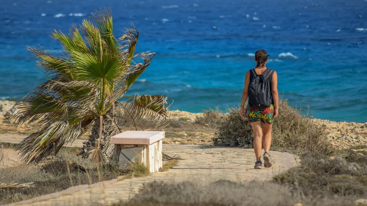 Woman, walking, path — illustrating How to Lower Your Biological Age: What Works