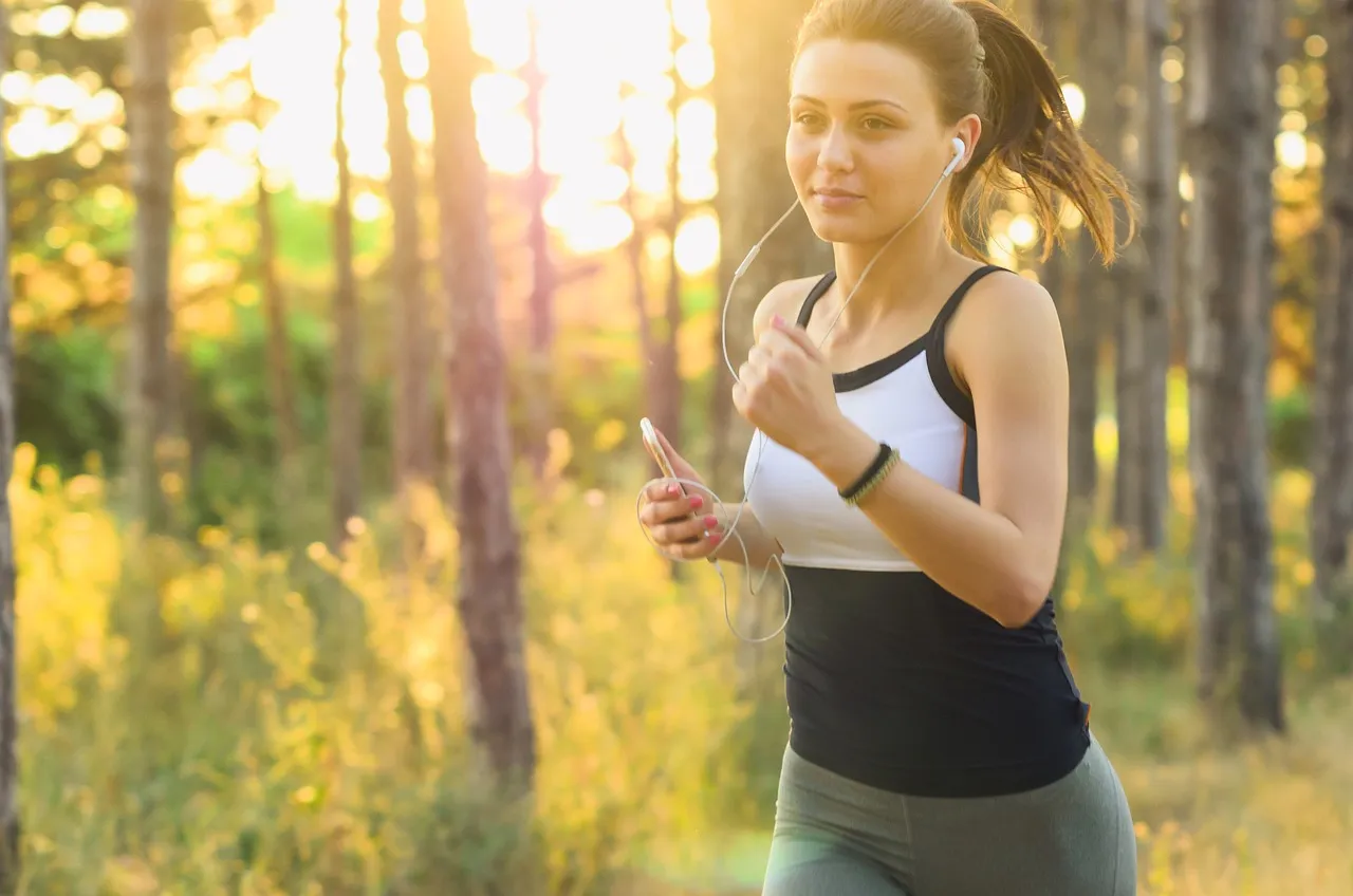 Woman, jogging, running — illustrating HRV-Guided Training: Does Listening to Your Nervous System Work?