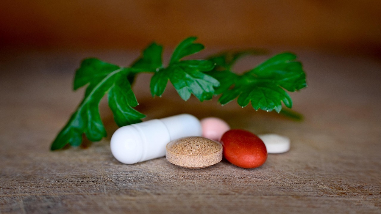 Vitamins, antibiotics, parsley — illustrating NMN vs NR: Comparing the NAD+ Precursors