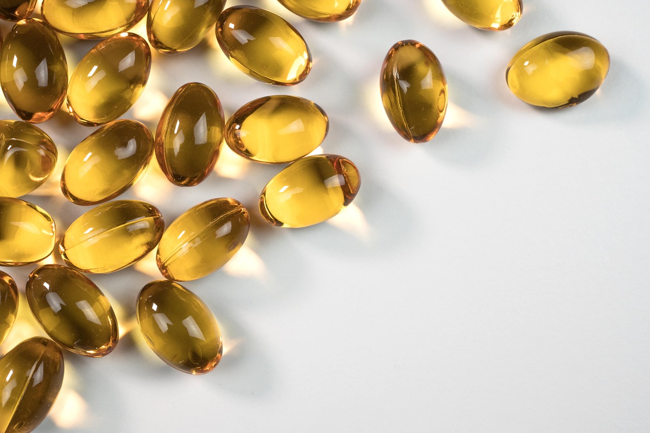 Gel capsules, capsules, medicine — illustrating Omega-3s and Muscle Soreness
