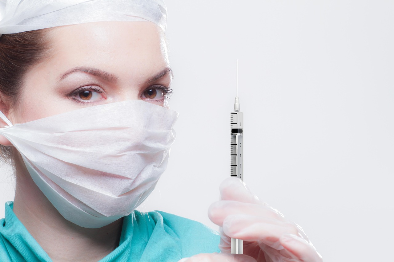 Woman, healthcare professional, syringe — illustrating Oral Semaglutide: Does the Pill Match the Injection?