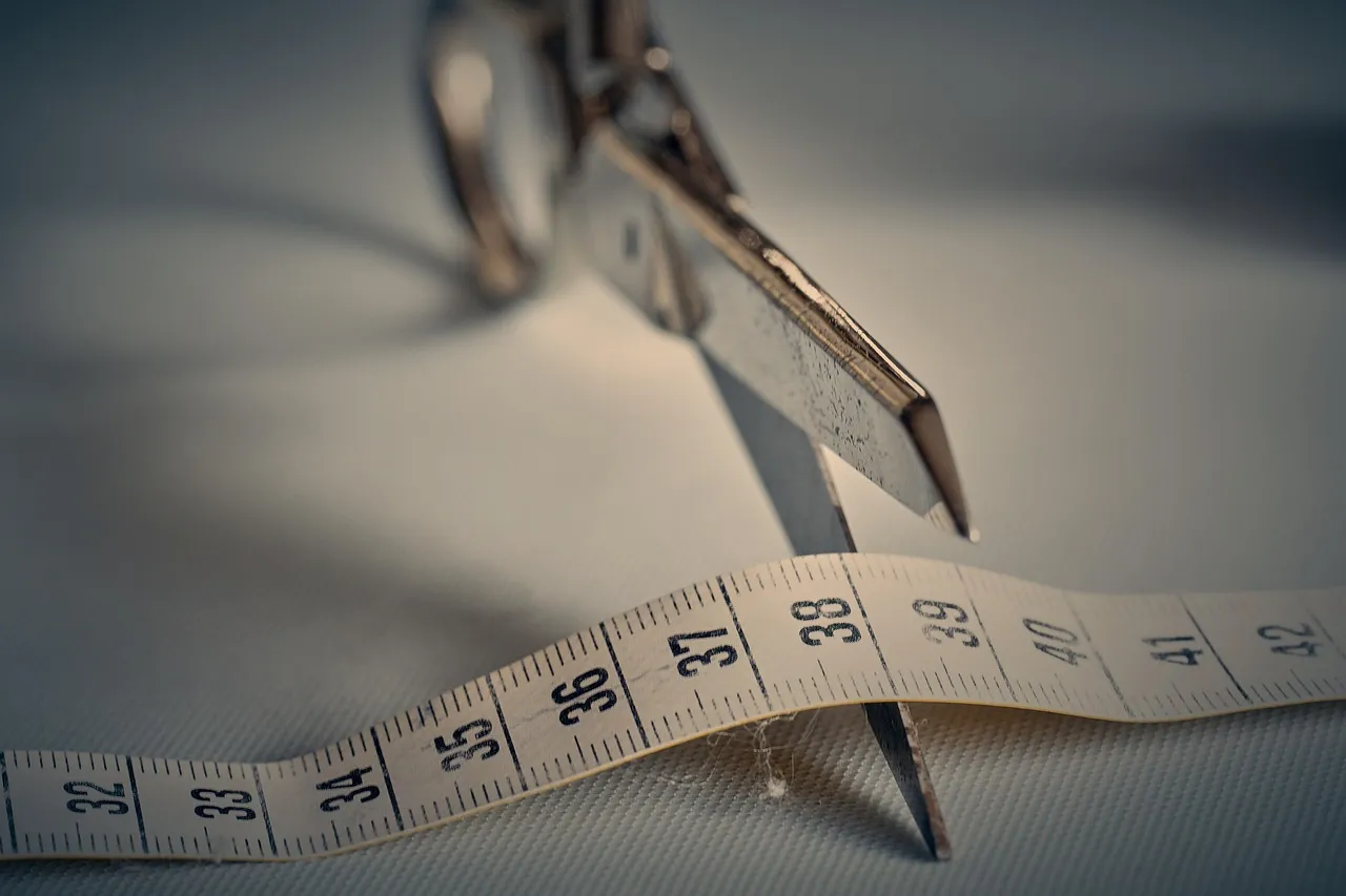 Scissors, tape measure, measurement — illustrating '"Ozempic Face": Facial Aging and Rapid Fat Loss'