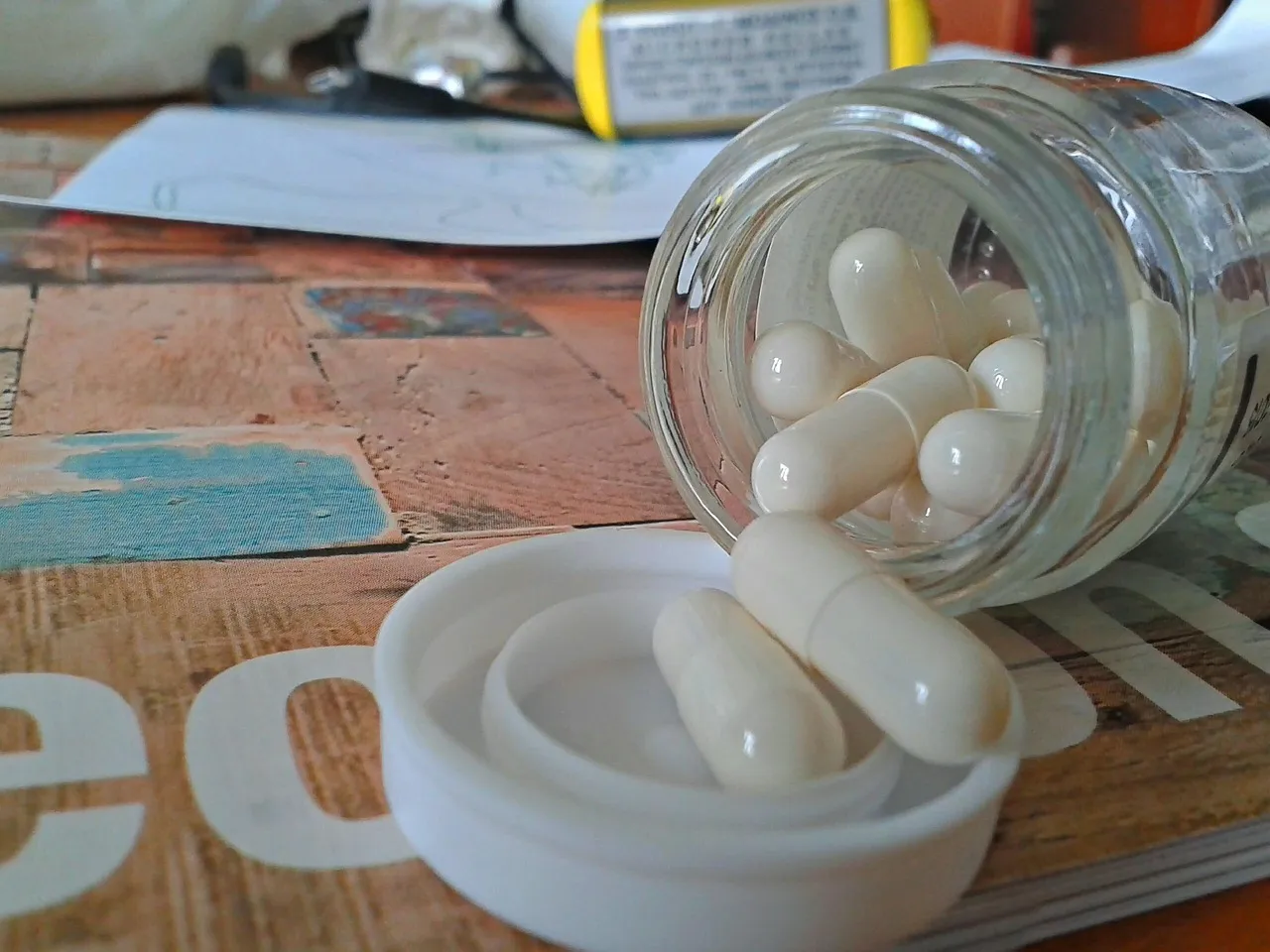 Pills, pill bottle, bottle — illustrating Peptide Dosing Units Explained: mcg, mg, mL, IU, and Insulin Units