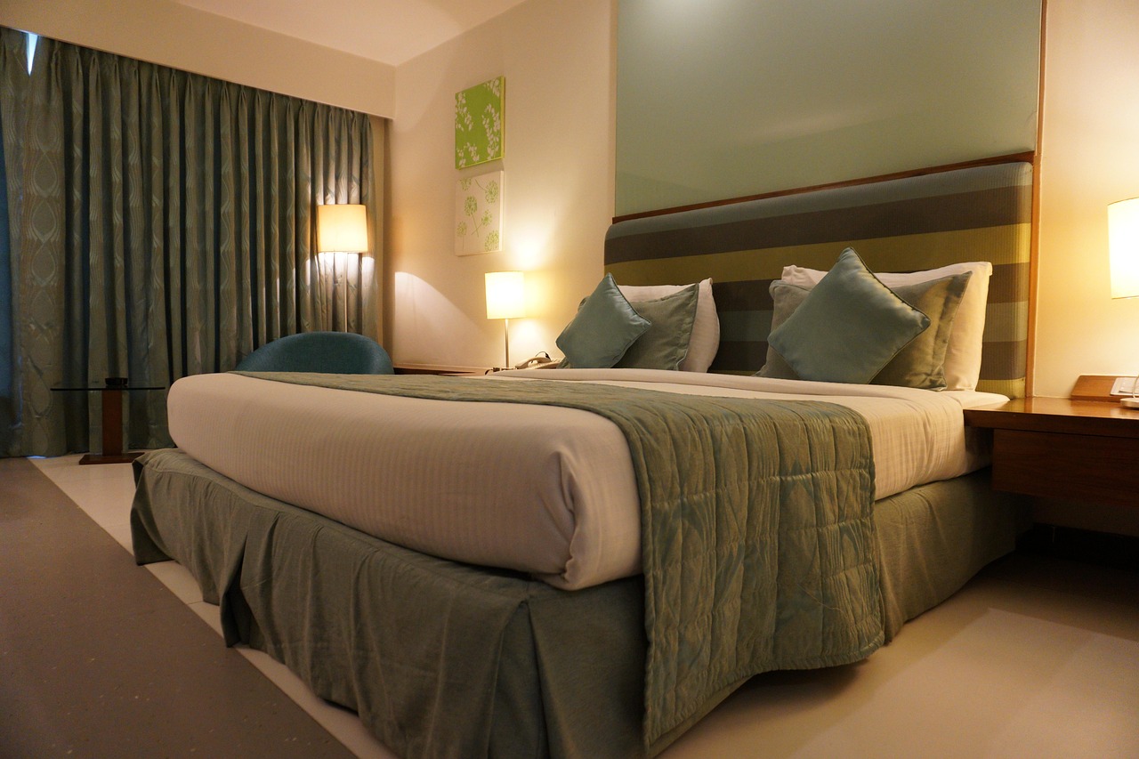 Hotel, room, bed — illustrating Sleep and Muscle Recovery: What the Evidence Shows