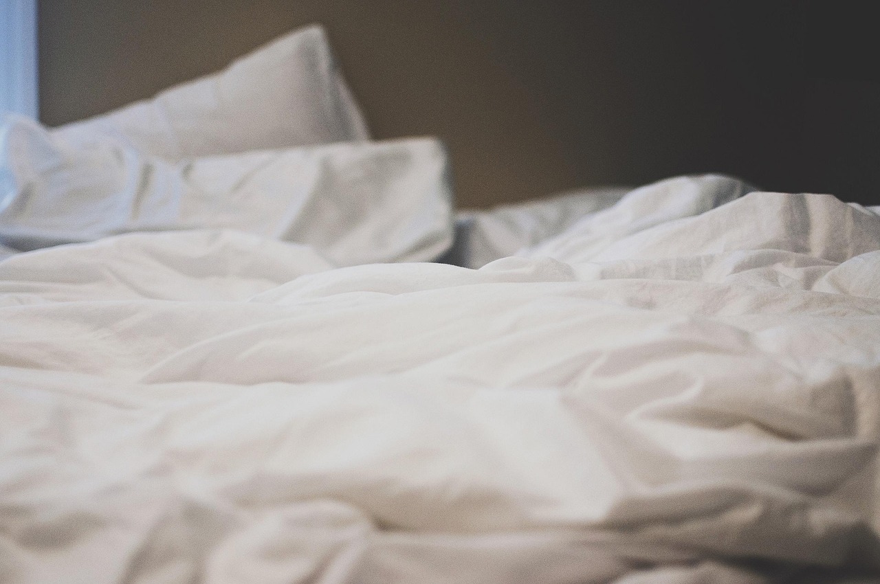 Bed, sheets, pillows — illustrating Sleep Trackers: How Accurate Are They?