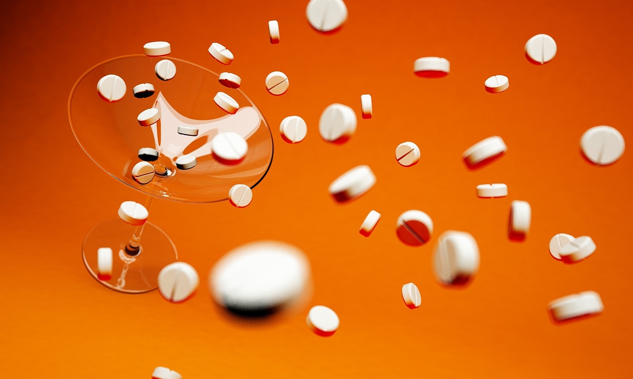 Tablets, cocktail glass, medical — illustrating Tesamorelin: The One Peptide With Real FDA Approval