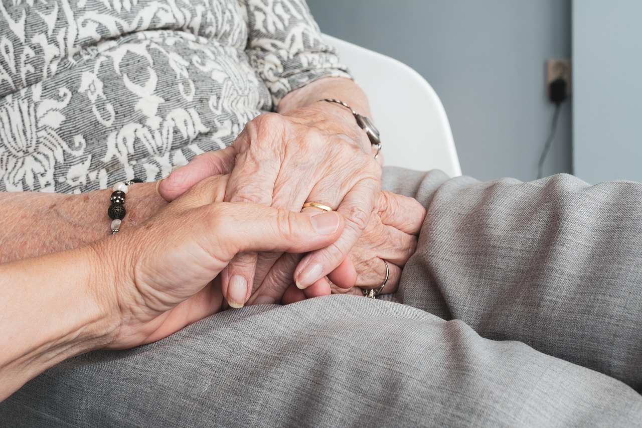 Hands, old, old age — illustrating The Longevity Escape Velocity Debate