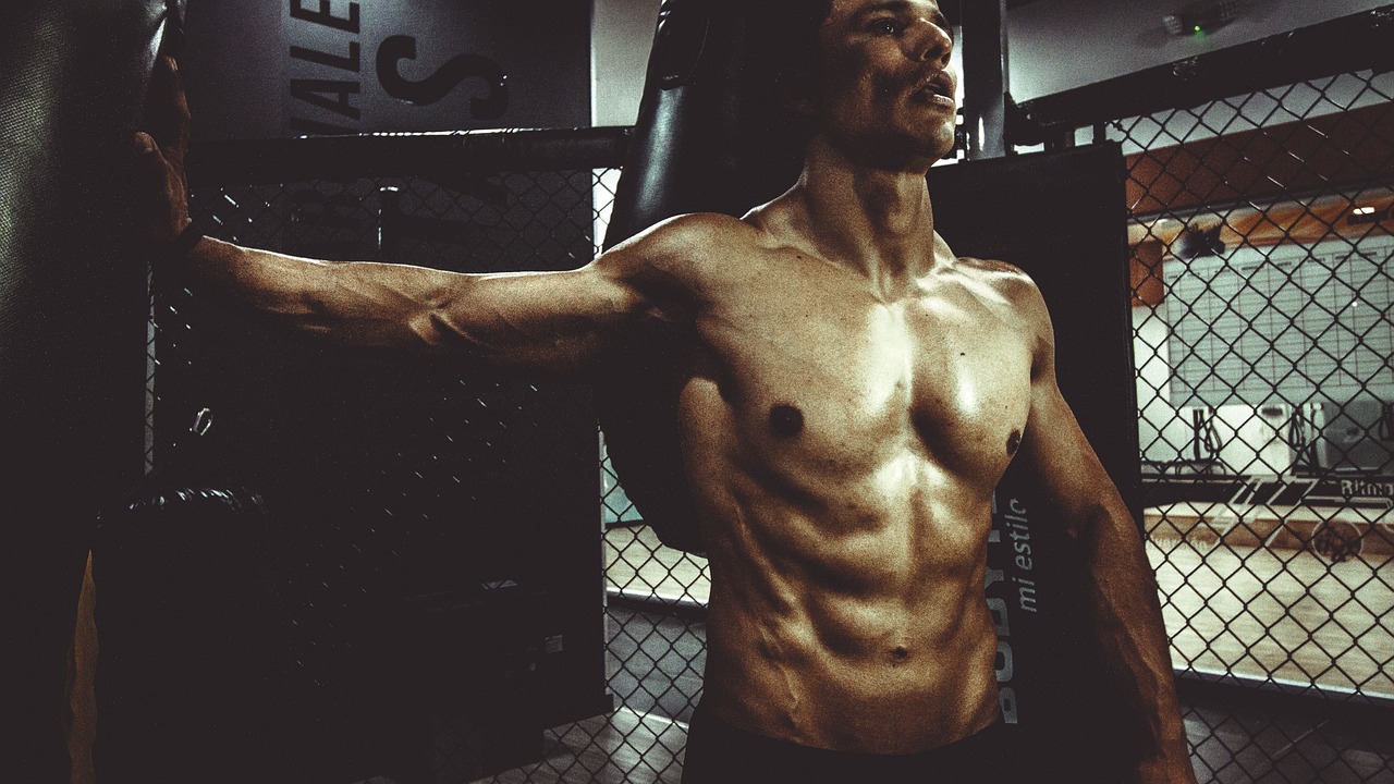 People, man, muscle — illustrating The Science of Deloading: Why Less Builds More