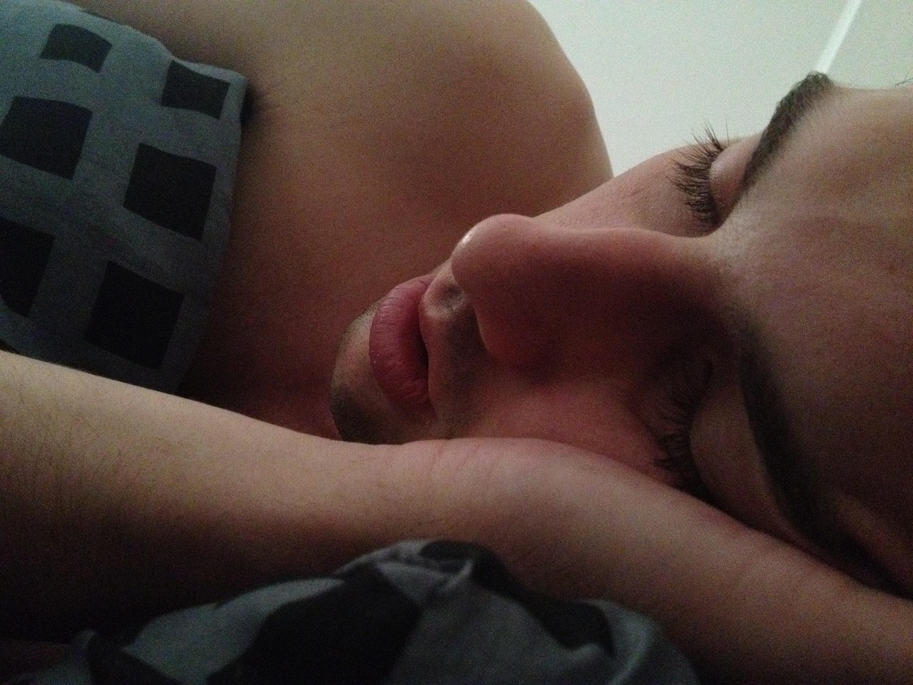 Sleeping time, man, bedroom — illustrating The Complete Guide to Sleep for Athletes